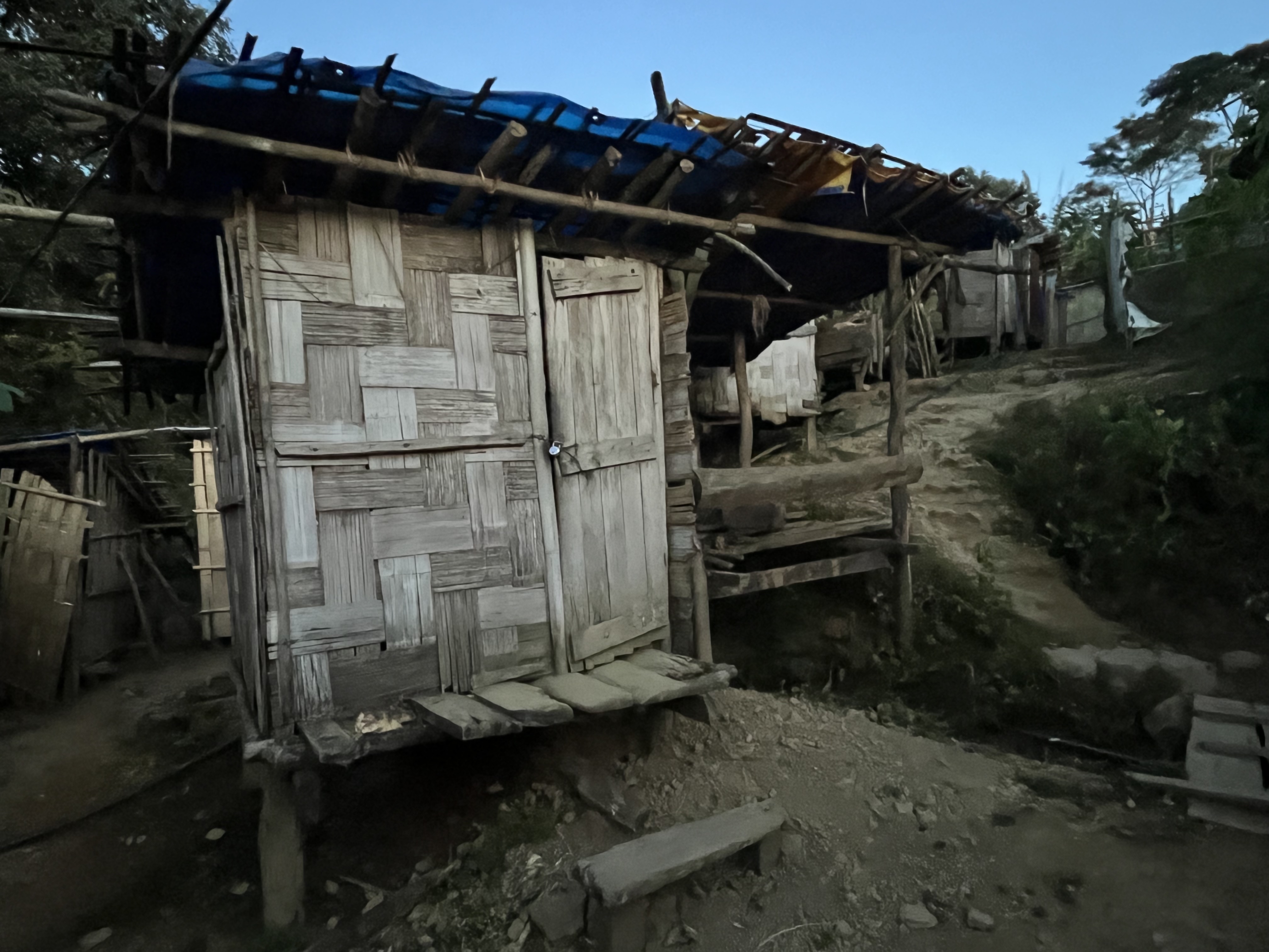 Bamboo and tarpaulin shelter in a refugee camp, Mizoram